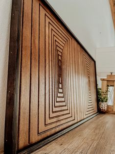 a wood paneled wall in an empty room