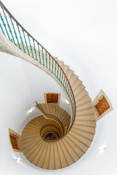 an overhead view of a spiral staircase in a building