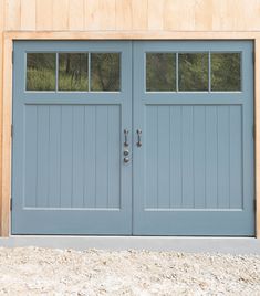 two blue garage doors sitting next to each other