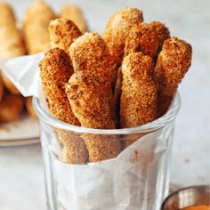 some fried food is in a glass on the table