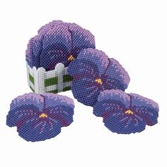 three purple flowers are shown in the shape of a puzzle box with four pieces missing