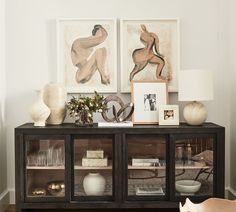 a living room filled with furniture and pictures