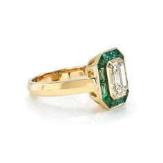 2.00ct M/VVS1 GIA certified emerald cut diamond with 1.05ctw French cut green emeralds bezel set in a handcrafted 18K yellow gold mounting. French Cut, Emerald Cut Diamond, Single Stone, Stone Collection, Band Bracelet, Antique Diamond, Fine Jewelry Collection, Emerald Cut Diamonds, Chain Ring