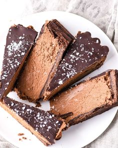 several pieces of chocolate cake on a white plate