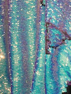 a blue and purple shawl with sequins on it