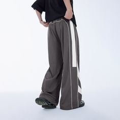 Revive your wardrobe with our Retro Track Pants in Grey. Embrace the trend in wide-leg style for ultimate comfort and timeless fashion. Upgrade your look today! Streetwear Bottoms With Three Stripes, Casual Streetwear Pants With Three Stripes Branding, Sporty Parachute Pants With Reflective Details For Streetwear, Sportswear Streetwear Pants With Three Stripes Branding, White Three-stripes Sweatpants For Streetwear, Dance Pants Hip Hop, Black Wide Leg Pants, Dance Pants, Tactical Pants