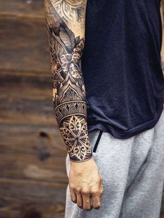 a man with a tattoo on his arm