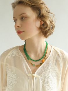 This necklace combines antique sand-gold accessories with handcrafted Kong-style knots and natural green onyx beads, showcasing timeless elegance and cultural charm. The detachable accessories can be worn separately or layered for versatility and statement-making style. A must-have for those seeking sophistication. Metal: 18K Recycled Gold Plated On Brass Gemstone: Green Onyx 6mm Necklace Total Length: 930mm Removable Bracelet Part Length: 180mm Weight: 48g Handmade Gold Jade Beaded Necklaces, Gold Beaded Jade Necklace, Bohemian Gold Jewelry With Green Onyx, Bohemian Green Onyx Gold Jewelry, Gold Necklace With Green Onyx Gemstone Beads, Green Necklaces With Gold Beads For Jewelry Making, Vintage Green Double Strand Necklaces, Elegant Gold Beaded Necklaces With Green Onyx, Elegant Gold Beaded Necklace With Green Onyx