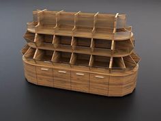 a wooden shelf with several compartments on it and one section open to show the contents