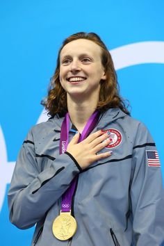 a woman with a medal around her neck