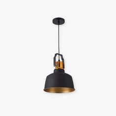 a black and gold pendant light hanging from the ceiling