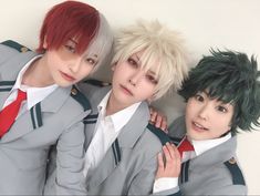 three young men with short hair are posing for a photo in front of a white wall