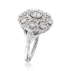 Ross-Simons - C. 2000 Vintage .93 ct. t. w. Diamond Ring in 14kt White Gold. Size 6.5. C. 2000. Nearly hypnotic in its captivating symmetrical design, our gorgeous Estate collection ring boasts .71 ct. t. w. round and round Old European-cut diamonds around a stunning .22 carat round brilliant-cut diamond center to complete a beautiful circle of superb sparkle. Finely crafted in polished 14kt white gold. 5/8" wide. Diamond ring. Exclusive, one-of-a-kind Estate Jewelry. Diamond birthstones are the Classic Platinum Cluster Ring, Classic Platinum Cluster Halo Ring, Classic Cluster Diamond Ring In Platinum, Classic Platinum Cluster Diamond Ring, Classic Platinum Ring With Pave Setting, Classic Platinum Rings With Pave Setting, Classic Diamond Cluster Ring With Center Stone, Classic Cluster Diamond Ring With Center Stone, Classic Oval Diamond Ring With Pave Setting