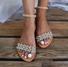 Add to your look these beautiful bridal sandals with silver stones and rhinestones and steal the show. Full sizes only ** If you have half the size, go UP to the nearest full size This model has narrow straps, please if you have wide legs or wide ankle choose a larger size. ** If you are unsure of your size, please contact me so I can assist you. Check out our other wedding sandals here: MORE WEDDING SANDALS: https://www.etsy.com/listing/935470092/wedding-sandals-bridal-sandals-beach?ref=shop_ho Stone Embellished Open Toe Sandals For Wedding, Wedding Sandals With Rhinestones And Single Toe Strap, Glamorous Bedazzled Wedding Sandals, Wedding Sandals With Rhinestones And Round Toe, Flat Heel Sandals With Rhinestones For Wedding, Flat Heel Rhinestone Sandals For Weddings, Glamorous Flat Sandals For Wedding, Bedazzled Open Toe Wedding Sandals, Bedazzled Open Toe Sandals For Wedding