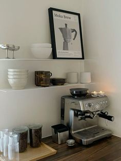 a coffee maker sitting on top of a wooden counter