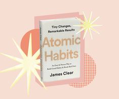 the book atomic habits by james clear is on top of a pink background