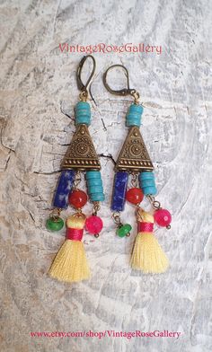 "Colourful Mexican Aztec Earrings, Colourful Bohemian Earrings, Boho Artistic Earrings, Chandelier Earrings A bohemian pair of chandelier earrings inspired by the Mexican and Aztec Jewellery Features : lapis lazuli gemstones, carnelian gemstones , jade , turquoise gemstones , small silk tassels antique bronze findings with mexican style , and antique bronze lever backs . The most interesting , joyful, impressive, artistic and colourful earrings Measures approx. 2 1/2 \" - 7 cm in length. 🌹Selec Bohemian Dangle Earrings For Jewelry Making, Artistic Dangle Jewelry For Festivals, Multicolor Brass Beaded Earrings For Festival, Multicolor Dangle Beaded Brass Earrings, Multicolor Brass Dangle Beaded Earrings, Adjustable Multicolor Brass Earrings, Festival Tassel Dangle Earrings, Dangle Tassel Earrings For Festivals, Multicolor Brass Drop Earrings