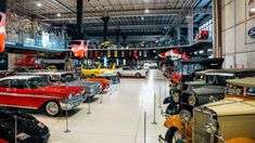 a museum filled with lots of old cars