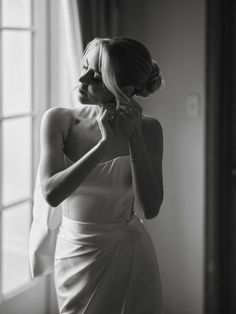 black and white photograph of a woman in a wedding dress