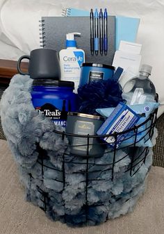 a basket filled with items sitting on top of a bed