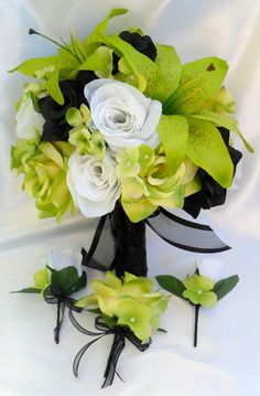 a bridal bouquet with white and green flowers