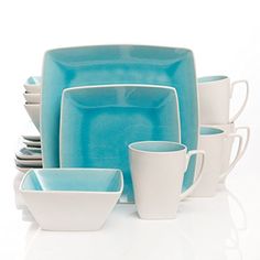 blue and white dishes are stacked on top of each other