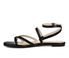 The Serissa sandals by Journee Collection are the ultimate summer go-to. This foot-framing fit features slender vegan leather crisscross straps and a dainty buckle closure. A tiny block-heel and a heavenly padded footbed finish this warm-weather companion. Vegan leather upper,Adjustable buckle closure for a custom and secure fit,Approx. 1/2 inch heel,Open toe,Padded footbed for added comfort,Durable manmade outsole | Women's Journee Collection Serissa Flat Sandals in Black Size 7 Medium Shoe Carnival, 2 Inch Heels, Womens Sandals Flat, Journee Collection, Flat Sandals, Warm Weather, Block Heels, Open Toe, Vegan Leather