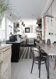 the kitchen is clean and ready to be used as a dining room or living room