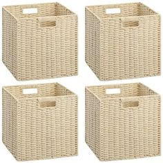 four white wicker baskets with handles