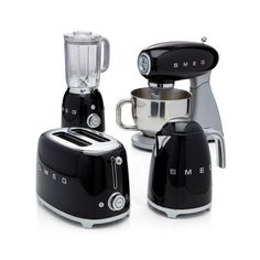 three black and silver blenders sitting next to each other