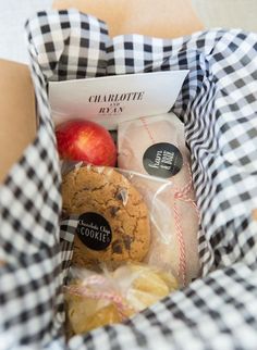 a basket filled with cookies and an apple