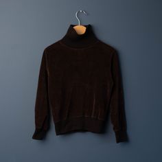 70s / 80s  Vintage dark brown velour turtleneck long sleeved top.  In excellent condition without no staining, flaws or holes. Tag is missing.   Best fit for 5-6 years. *ALL ITEMS ARE VINTAGE, PASSING THROUGH A NON-SMOKING HOME.  SOME SIGNS OF WEAR ARE TO BE EXPECTED AS MANY ITEMS ARE OVER 20 YEARS OLD.  MAJOR FLAWS WILL BE DISCLOSED IN LISTING.  PLEASE INSPECT ALL PHOTOS CAREFULLY . * *PLEASE READ ALL SHOP POLICIES AND SHIPPING ESTIMATES BEFORE PURCHASING.  NO REFUNDS.  NOT RESPONSIBLE FOR LOST/UNDELIVERABLE PACKAGES SHOULD BUYER CHOOSE UNTRACKED SHIPPING* *SHIPPING OVERAGES ALWAYS REFUNDED WHEN BUNDLING ITEMS. Vintage Brown Tops For Winter, Vintage Turtleneck Tops For Fall, Brown Funnel Neck Top For Fall, Vintage Brown Top For Winter, Vintage Turtleneck Tops For Winter, Fall Brown Funnel Neck Top, Vintage Turtleneck, Fitted Brown Turtleneck With Long Sleeves, Vintage Turtleneck Winter Tops