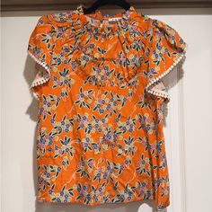 Never Worn Spring Printed Blouse With Butterfly Sleeves, Spring Blouse With Printed Butterfly Sleeves, Cotton Tops With Floral Print And Butterfly Sleeves, Orange Short Sleeve Blouse For Spring, Casual Printed Blouse With Butterfly Sleeves, Orange Ruffled Short Sleeve Blouse, Orange Short Sleeve Blouse With Ruffles, Floral Print Butterfly Sleeve Blouse For Brunch, Floral Print Blouse With Butterfly Sleeves For Brunch