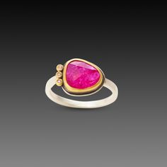 A juicy pink, rose cut ruby is wrapped in warm 22k gold accented with three sparkling diamonds on the side. This ring would make a stunning alternative engagement ring, or a special addition to your jewelry collection. Sterling silver back and 2mm hammered band. The center stone measures approximately 3/8 inch x 1/2 inch. Matte finish. Pink Ruby Ring With Rose Cut Diamonds, Gold Rings With Rose Cut Diamonds And Pink Sapphire, Anniversary Sterling Silver Ruby Ring With Rose Cut Diamonds, Pink Ruby Ring With Single Cut Diamonds, Pink Ruby Jewelry With Single-cut Diamonds, Gold Tourmaline Ring With Rose Cut Diamonds, Yellow Gold Pink Sapphire Rings With Single Cut Diamonds, Gold Jewelry With Rose Cut Diamonds And Pink Sapphire, Unique Ruby Ring With Bezel Setting For Anniversary