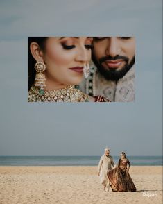 a man and woman standing on top of a beach next to each other under a photo