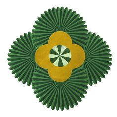 a green and yellow fan shaped object on a white background with an orange flower in the center