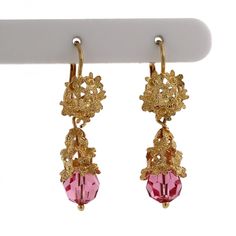 This is an exquisite pair of ornate 18K Italian Yellow Gold, Floral Drop Dangle Earrings. The Earrings feature an intricately crafted Floral Gold Design, with a beautiful Round Shaped, Faceted Pink Glass Bead Accent, measuring 7.60 mm in Diameter.  The Earrings measure 1.5" in Length x 10.85 mm in Width &10.85 mm Thick. These Vintage Drop Dangle Earrings are secured with Lever Backs, for a secure, worry-free wear. This stunning pair of Fine Vintage Earrings are being offered here for an unbeatab Drop Dangle Earrings, Pink Glass, Gold Design, Fine Jewellery Earrings, Diamond Gemstone, Gold Material, Vintage Earrings, Vintage Floral, Jewelry Stores