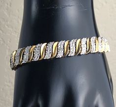 This is a lovely vintage sterling silver tennis bracelet featuring silver and gold vermeil finish, 104 small rough diamonds and a slide clasp with safety latch. The bracelet is hallmarked 925 and tests positive for sterling silver with the 18K acid solution - a video of testing is available upon request before purchasing. It also has a maker's mark. The diamonds were confirmed with the Presidium Gem Tester II and the video is available upon request. Collectible Valentine's Day gift. Weight: 19.3 Anniversary Bracelets With Bling, Anniversary Bling Bracelets, Silver Tennis Bracelet, Bracelet Tennis, Large Bracelet, Black Patch, Maker's Mark, Pretty Gift, Rough Diamond