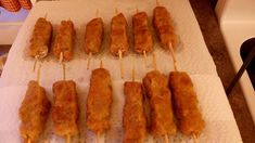 several skewers of food are sitting on a paper towel and ready to be cooked