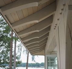 the front porch is covered with wood planks