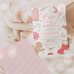 a pink and white birthday card with some decorations on it