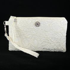 Bridal Ivory Wristlet Purse for the bride to be.  Designed to hold your essentials, this wristlet is small enough to carry easily, but big enough for all your needs!   This purse is made in Ivory Lace, and is suitable for a wedding, as a clutch for the bride, bridesmaid, or use with an evening formal.   Can also be used as a Makeup Bag, Phone Holder, or a Gift For The Bride. *Please note the Wristlet you receive will vary from the one pictured due to the cut of the fabric. The features of this w Cheap Trendy Evening Wristlet, Cheap White Wristlet For Gift, Affordable Trendy Wristlet For Parties, Cheap White Wristlet For Women, Cheap White Wristlet As A Gift, Cheap Trendy Wristlet For Party, Cheap Women's White Wristlet, Chic Cheap White Wristlet, Cheap Elegant Wristlet With Removable Pouch