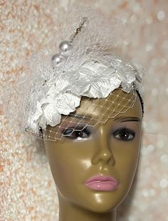 White Satin Flower Fascinator Half Hat, Weddings, Church, Tea Parties, and other Special Occasions  Accented with veil netting, rhinestones, and hat pin. White flowers create this beautiful fascinator hat. Available in 2 sizes: 8 X 5.5 inches  10 X 7 inches Mannequin is wearing the 8 by 5.5 inches. SHIPPING  All items for free shipping will be shipped via USPS FIRST CLASS MAIL. Gifts for mom, sister, wife, or yourself. Elegant Adjustable Fascinator With Flower Decoration, Elegant Adjustable Flower Fascinator, Elegant Flower-shaped Adjustable Fascinator, Elegant Spring Wedding Headband, Elegant Spring Wedding Hair Accessories, Elegant Flower Hair Accessories For Kentucky Derby, Summer Wedding Fascinator With Flower Decoration, Elegant Handmade Flowers Fascinator, Elegant Mini Hat With Handmade Flowers On Headband