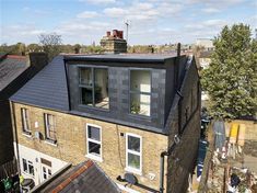 an aerial view of the roof of a brick building