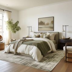 a bedroom with a large bed, chair and potted plant on the side wall