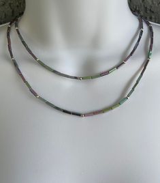 This double strand Rainbow Hematite choker and its iridescent properties is sure to enhance any outfit.  Finished with Sterling Silver clasp and links, this adjustable double strand necklace measures 15 1/4''- 16 1/2'' and has a drape of 1 1/2''. Adjustable Iridescent Choker Jewelry, Handmade Iridescent Adjustable Necklace, Iridescent Adjustable Necklace For Party, Adjustable Iridescent Necklace For Festivals, Iridescent Adjustable Necklace For Festivals, Hematite Necklace, Double Strand Necklace, Strand Necklace, Choker Necklace