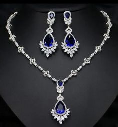 American diamond silver necklace and earrings very nice and very beautiful looking handmade item weight 85.500 gm (approx) Diamond weight 39.50ct Excellent cut diamond shape Round Color royal  Blue sapphire Synthetic  Color weight 29.50ct metal Sterling silver Necklace and earrings very nice finishing in silver Good cut in all American Diamond  thank you✍ 𝒮𝒽𝒾𝓂𝓂ℯ𝓇𝒾𝓃ℊ, 𝓼𝓹𝓪𝓻𝓴𝓵𝔂 𝓪𝓷𝓭 𝓲𝓻𝓻𝓮𝓼𝓲𝓼𝓽𝓲𝓫𝓵𝓮.𝓦𝓮'𝓿𝓮 𝓰𝓸𝓽 𝓽𝓱𝓮 𝓹𝓮𝓻𝓯𝓮𝓬𝓽 𝓪𝓬𝓬𝓮𝓼𝓼𝓸𝓻𝔂 𝓽𝓸 𝓶𝓪𝓽𝓬𝓱 ? Prom Jewelry Earrings, Prom Jewelry Sets, Bridal Brooch, Blue Sapphire Necklace, Golden Years, Prom Jewelry, Blue Bridal, Cz Jewelry, Wedding Jewellery Necklace