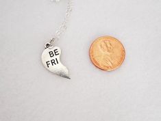 "Delicate best friends necklaces, perfect for a layering look, lovely to wear and wonderful to give. This listing is for two necklace chains and two charms, one half of the charm for you and the other half for your best friend. The best friends charm is made from a zinc alloy metal which is both lead and nickel free. You can choose between a 16 or 18 inch 2 mm cable chain in silver finished brass with a 1\" extender. The chain has a lobster claw clasp. Charm is zinc alloy and is 23mm x 23mm Lead Cute Nickel-free Charm Necklace For Friendship, Trendy Heart-shaped Necklace For Friendship, Nickel-free Heart Pendant Necklace For Friendship, Dainty Friendship Necklaces For Valentine's Day, Cute Heart Pendant Charm Necklace For Best Friend, Friendship Dainty Necklace For Valentine's Day, Dainty Friendship Necklace For Valentine's Day, Trendy Friendship Necklace For Valentine's Day, Cute Silver Charm Necklaces For Friendship