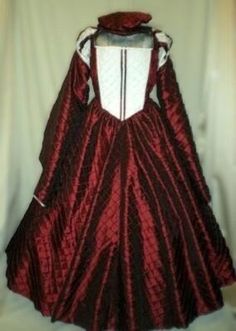 This auction is for a one piece Renaissance, Tudor, Medieval, Elizabethan or Anne Boleyn dress/gown and flat hat, your custom size choice of busts 32" - 44".   The outer gown, with the exception of the front bodice and upper puffy sleeves, is made of burgundy pintuck taffeta   And the front bodice and upper puffy sleeves are made of white pintuck taffeta, both of which have panels of burgundy taffeta accents.  Also, the outer circular sleeves are lined with plain white taffeta.  It has small puf Historical Ball Gown Dresses For Formal Occasions, Historical Formal Ball Gown Dresses, Historical Design Fitted Long Sleeve Dress, Historical Costume Party Dress With Fitted Bodice, Regency Style Fitted Costume Dress, Fancy Dress With Historical Design And Fitted Bodice, Costume Party Dress With Fitted Bodice And Historical Design, Fitted Regency Style Costume Dress, Historical Design Dress With Fitted Bodice For Costume Party