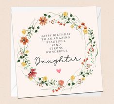 a birthday card with the words daughter in a floral wreath on it's front